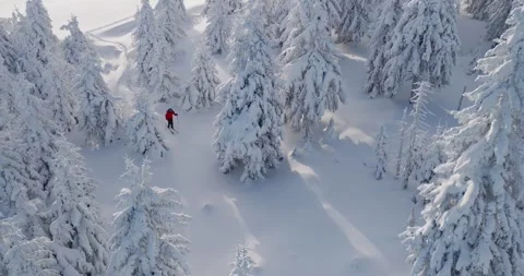 Smooth cinematic flight over a snow-covered alpine landscape Stock Footage 326133117