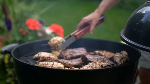 Smooth cinematic footage of backyard bbq Stock Footage 77970330
