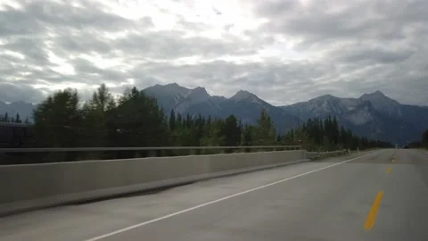 Smooth Cinematic Roadside Train out of Jasper National Park towards Edmonton Stock Footage 147060875