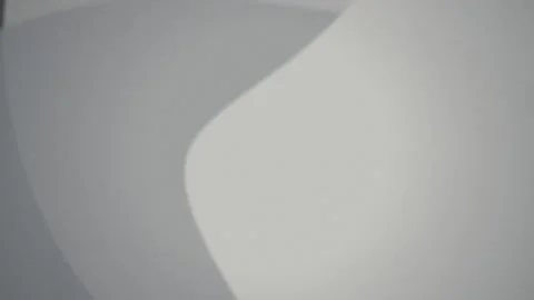 A smooth curved light gray surface rotates in a seamless loop Stock Footage 341401642