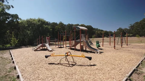 Smooth dolly side shot of empty playground during beautiful sunny day Stock Footage 145722728