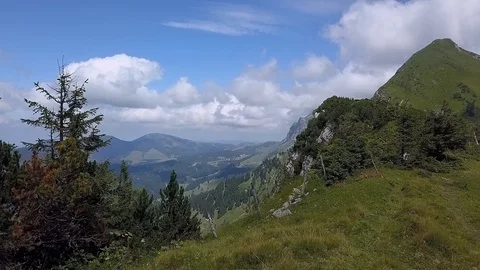 Smooth Dramatic Forward Drone Shot revealing the valley behind the alpine ridge Stock Footage 122213903