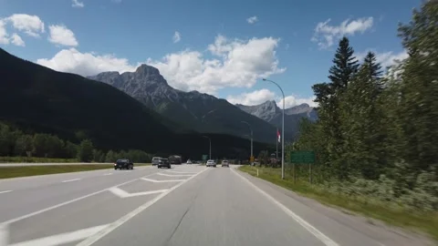 Smooth Drive Towards Banff in Alberta During Sunny Summer Day Stock Footage 146854186