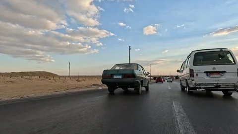 Smooth driving experience through Cairo Fayoum Desert Road wide desert horizons Stock-Footage 330070578