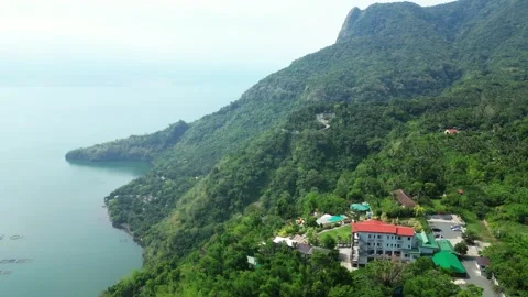 Smooth drone climb above the resort property revealing the full landscape of 스톡 동영상 336705306