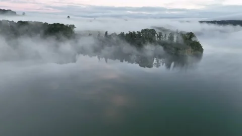 Smooth drone flight over lake and lake shore. Stock Footage 230720999