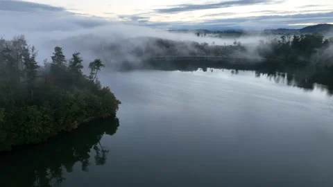 Smooth drone flight over lake and lake shore. Stock Footage 230721578