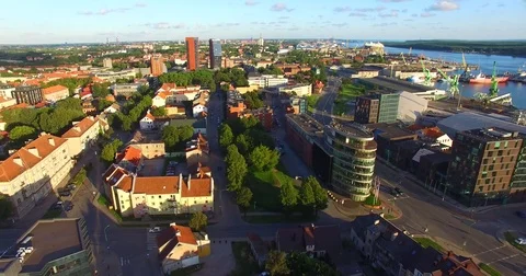 Smooth drone flight through Klaipeda City at low altitude - 7 Stock Footage 79517685