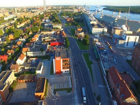 Smooth drone flight through Klaipeda City at low altitude - 5 스톡 동영상 79518393
