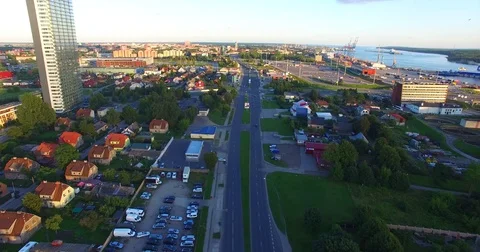 Smooth drone flight through Klaipeda City at low altitude - 4 Stock Footage 79518984