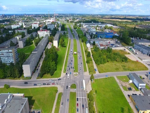 Smooth drone flight through Klaipeda City at low altitude - 18 Stock Footage 79542574