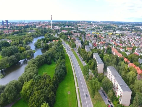 Smooth drone flight through Klaipeda City at low altitude - 15 Stock-Footage 79543795