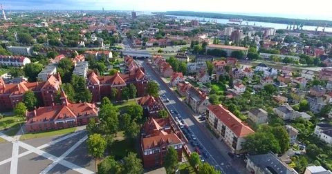 Smooth drone flight through Klaipeda City at low altitude - 12 Stock-Footage 79551181