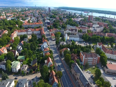 Smooth drone flight through Klaipeda City at low altitude - 11 스톡 동영상 79551650