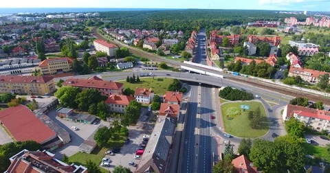 Smooth drone flight through Klaipeda City at low altitude - 9 Stock Footage 79552560