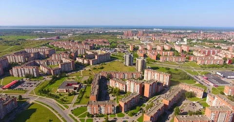 Smooth drone flight through Klaipeda City at low altitude - 24 Stock Footage 79555738