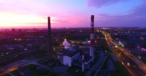 Smooth drone flight upward to high altitude at sunset. City lights - 1 Stock Footage 81131230