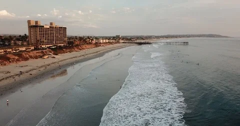 Smooth Drone Flying over Pacific Ocean &amp; Waves Crashing in San Diego Southern CA Video stock 95905203