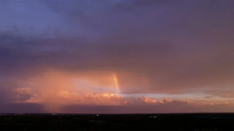 Smooth Drone Hyperlapse of Beautiful Rainbow and Lightening during Sunset Stock Footage 204022908