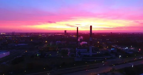 Smooth drone lateral movement at sunset near the factory chimneys - 2 Stock Footage 81129399