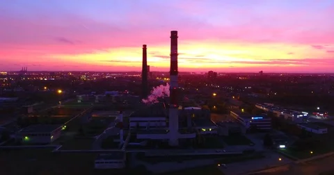 Smooth drone lateral movement at sunset near the factory chimneys - 3 Stock-Footage 81130141