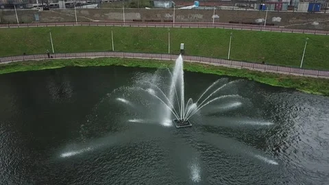 Smooth drone orbit around river fountain Stock Footage 324635706