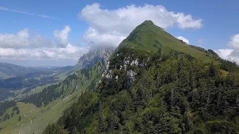 Smooth Drone shot of Alpine Ridge moving sideways. Sunlight an some clouds Stock Footage 122217415