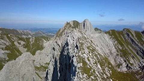 Smooth Drone shot of mountain peak with hikers on summer day Stock Footage 122246333