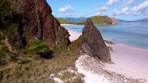 Smooth drone shot from Pink Beach in Indonesia 2.7K Stock Footage 248761902