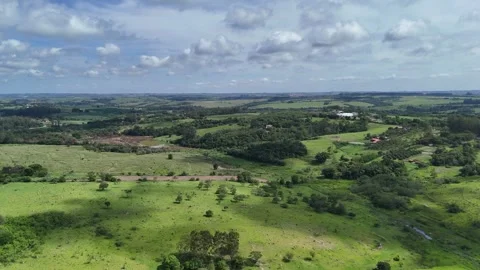 Smooth Drone Tracking Shot Over Open Field – 4K Stock Footage 325351447