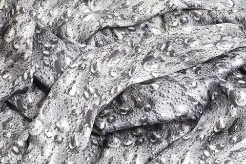 Smooth elegant grey silk texture with a pattern in the form of drops. Foto stock