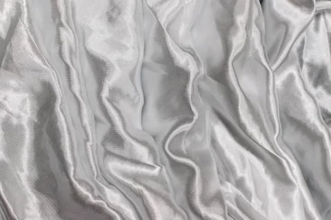 Smooth elegant silver silk or satin luxury cloth texture Stock Photos