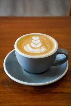 A smooth espresso-based drink blended with steamed milk Stock Photos