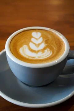 A smooth espresso-based drink blended with steamed milk Stock Photos