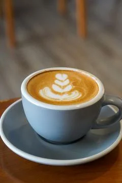 A smooth espresso-based drink blended with steamed milk Stock Photos