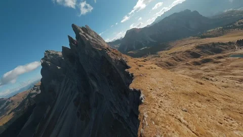 Smooth flight along the mountain range, filmed by FPV drone. Seceda, Italy Stock Footage 293636044