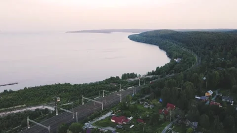 Smooth flight on a drone forward over the railway, a train is traveling Vidéo 161434941