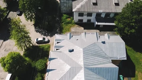 Smooth flight on a drone over the gray roofs of small concrete houses Video stock 161434151