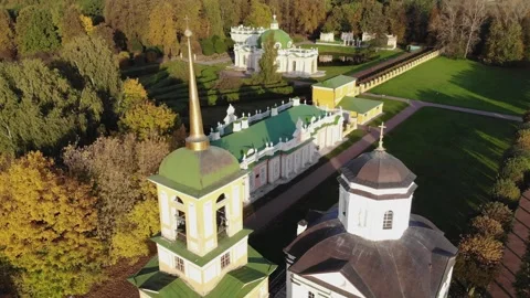 Smooth flight of a drone over a landscaped park on a sunny autumn day Stock Footage 256813982