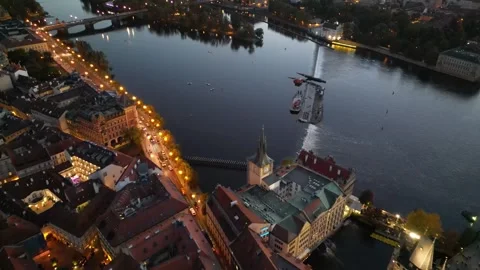 A smooth flight of a drone over the river and the architecture of Prague Stock Footage 256690942