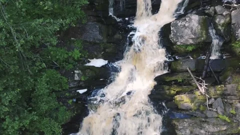 Smooth flight of the drone from a small waterfall Video stock 161824581