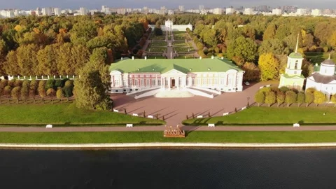 A smooth flight over a lake and a landscaped park on a sunny day. Aerial view Stock Footage 256690283