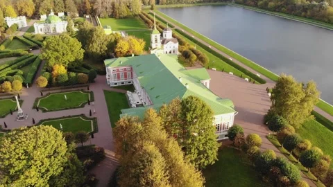 A smooth flight over a lake and a landscaped park on a sunny day. Aerial view Stock Footage 256690345
