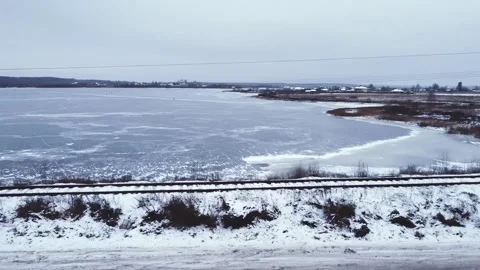 Smooth flight over the railroad and road, where a car passes Video stock 152832093