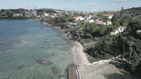 Smooth flight over the sea along the coastline on a sunny summer day Stock Footage 256158262
