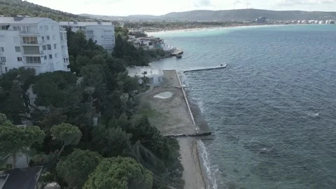 Smooth flight over the sea along the coastline on a sunny summer day Stock Footage 256158286