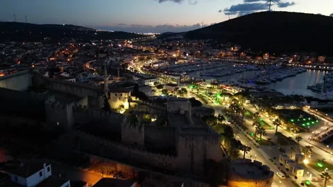 Smooth flight over a small coastal town in the evening Stock Footage 257088067