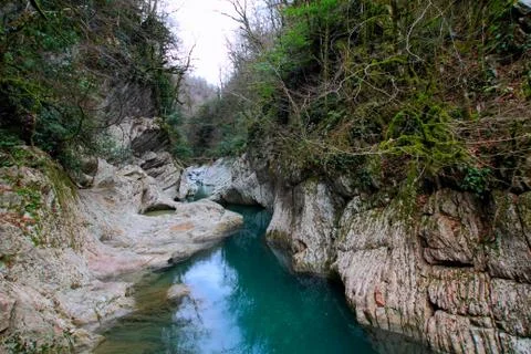 The smooth flow of the Khosta river. Stock Photos