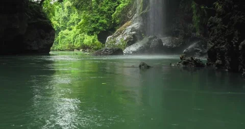 Smooth Flowing River in Tropical Canyon with Natural Rock Texture Stock-Footage 332490375