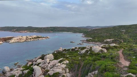 Smooth Forward Drone Through Rocks Toward Open Mediterranean Sardegna Vídeo Stock 333693946